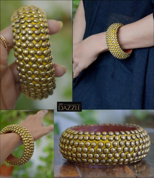 Wooden bangle with brass repousse