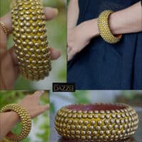 Wooden bangle with brass repousse