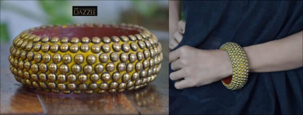 Wooden bangle with brass repousse